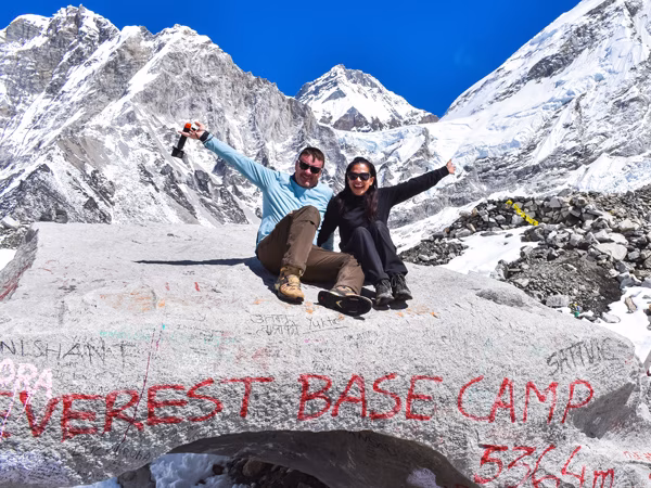 Two trekkers soaking in the achievement at Everest Base Camp Trek.