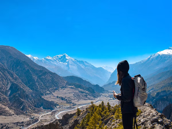 Female trekker enjoying a Himalayan landscape in Nepal