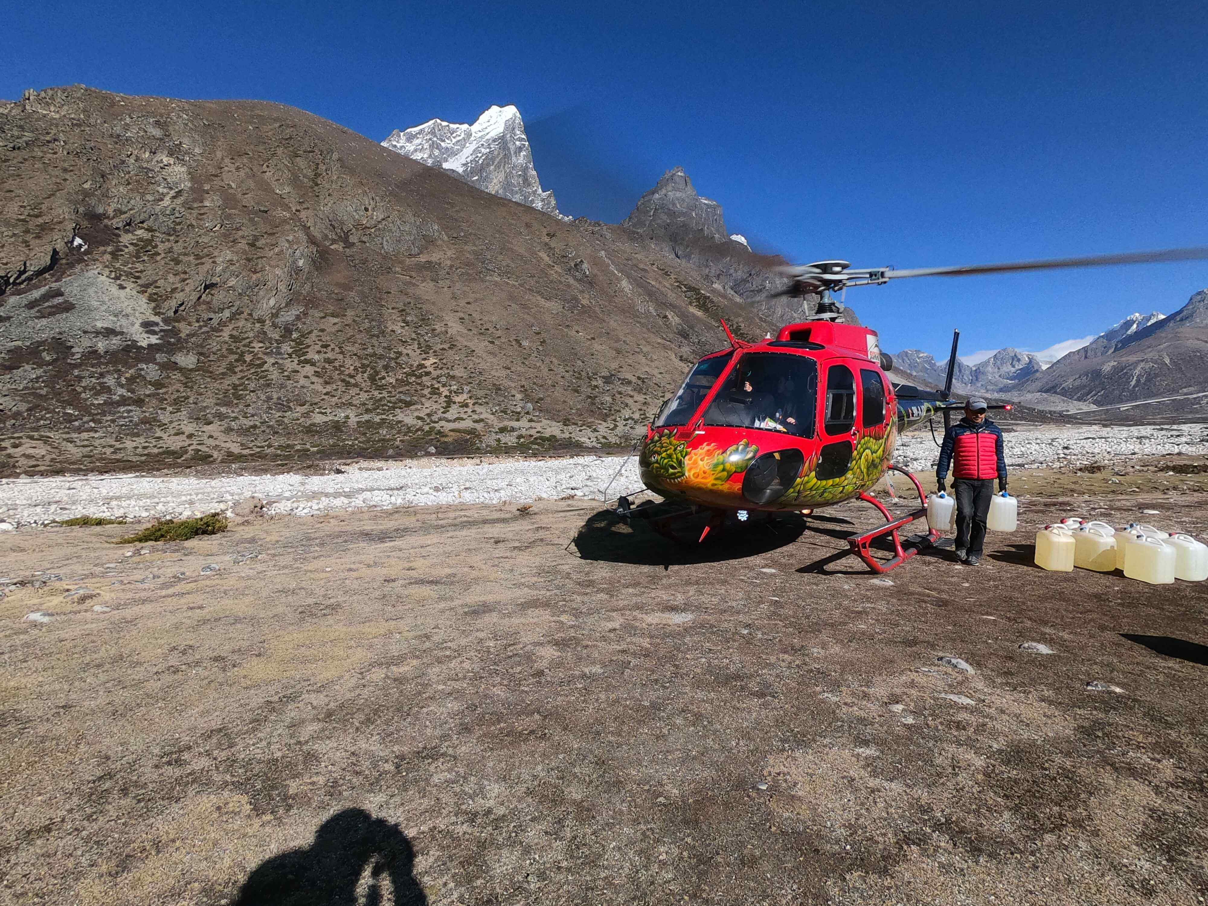 Preparing for helicopter return after short EBC trek.