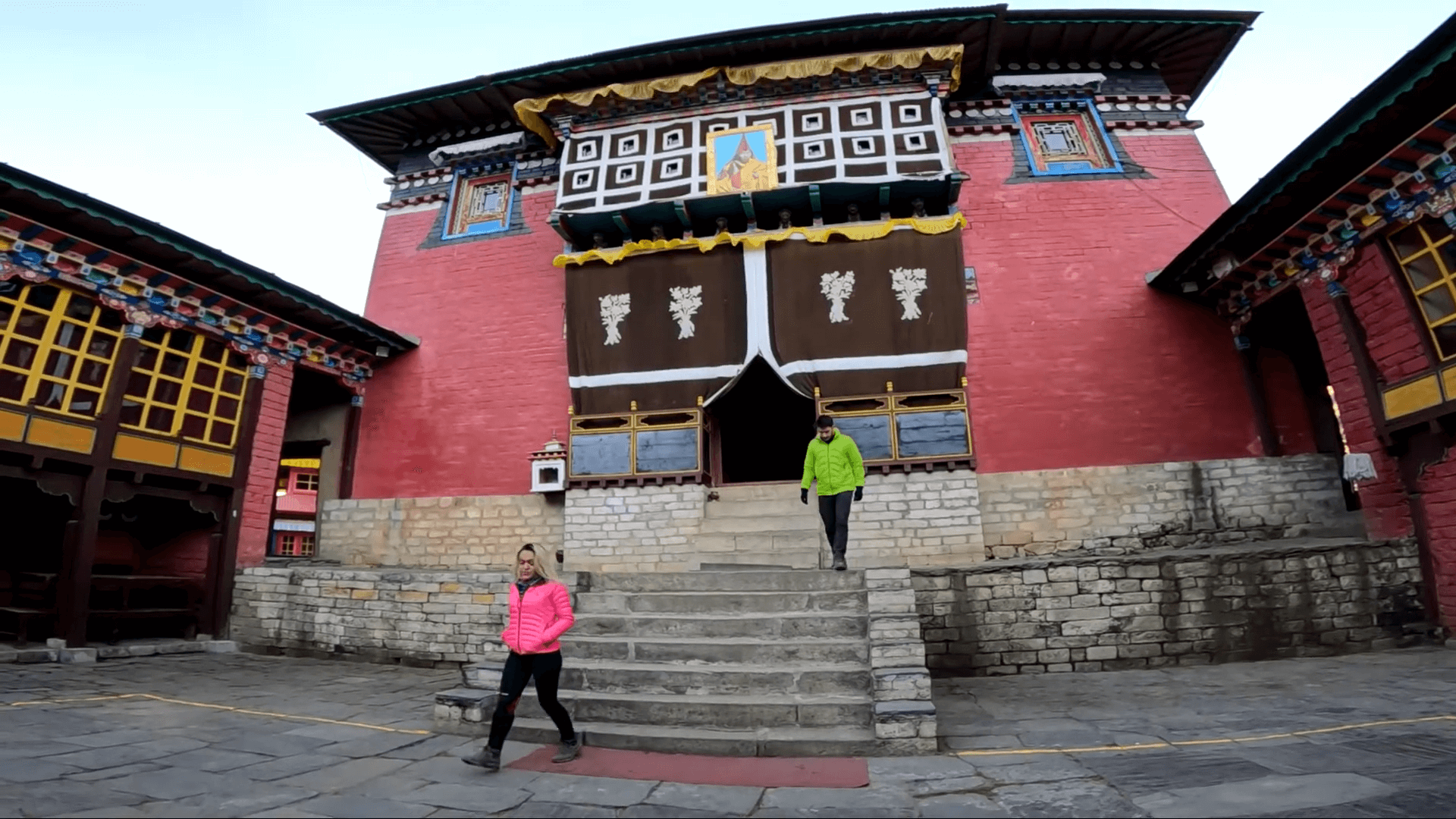 Inside view of Tengboche Monastery with two visiting trekkers.
