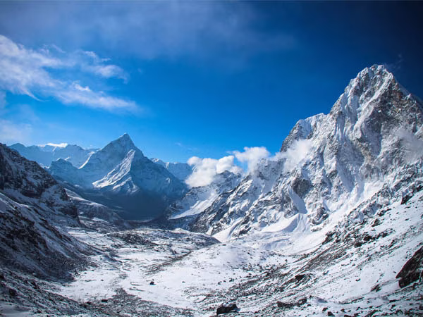 Trekkers ascend the rugged mountain trail on the way to crossing one of the legendary high passes during the Everest Three High Passes Trek in Nepal's Khumbu region.