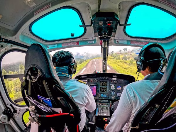 Helicopter take off from Lukla Airport after short refueling break