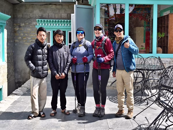 Our experienced guide shares a memorable moment with international trekkers in Namche Bazaar, the gateway to the Everest Base Camp Trek.