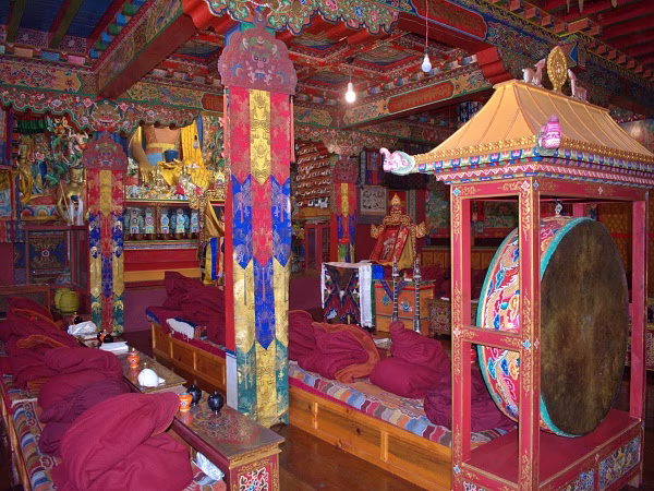 Prayer hall inside Tengboche Monastery with traditional Buddhist artwork on the Everest View Trek